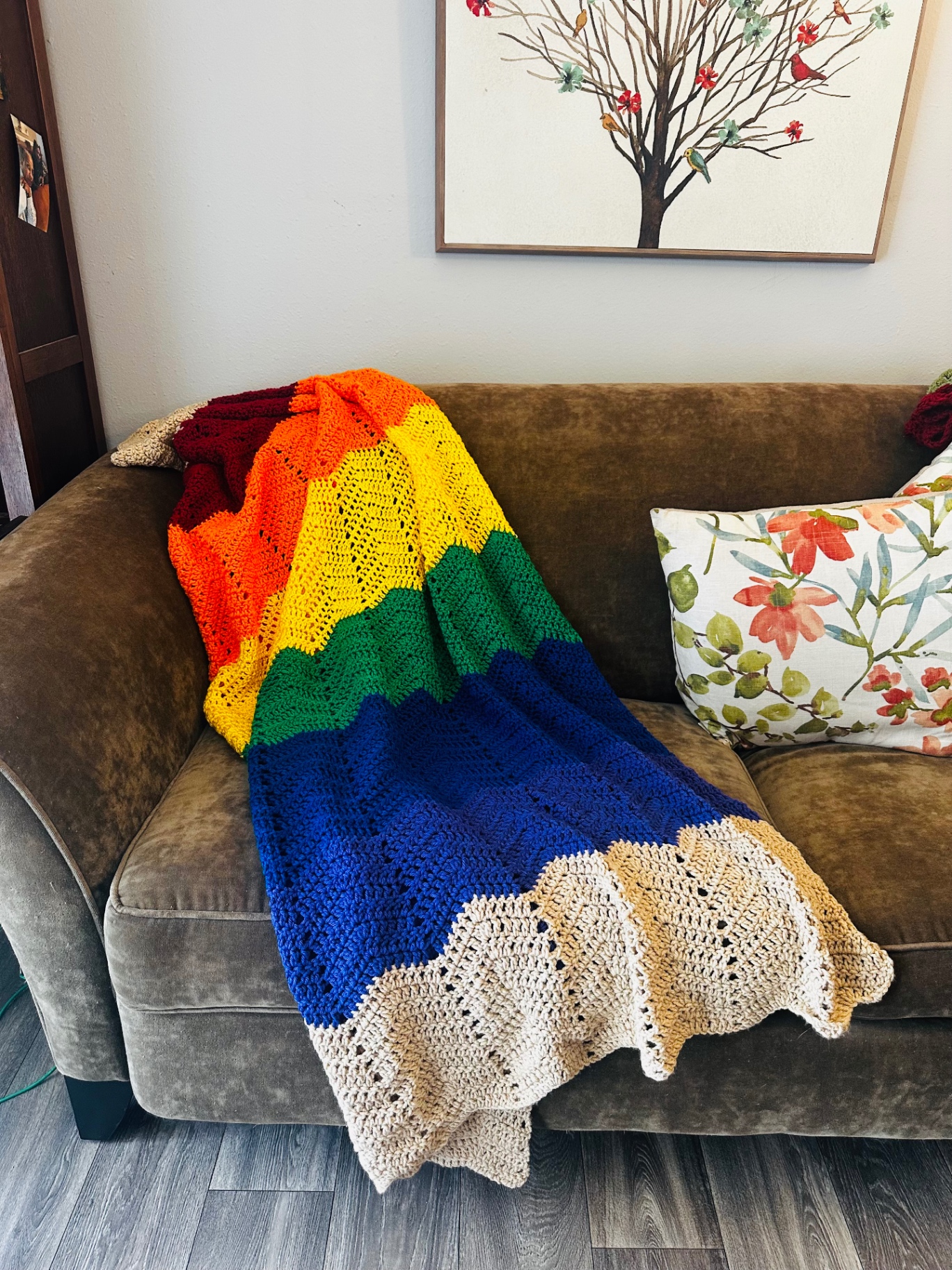 Spectrum Ripple Throw — handmade crochet blanket, Warm reds, orange, yellow, green, blue and purple stripes with a cream edge.
